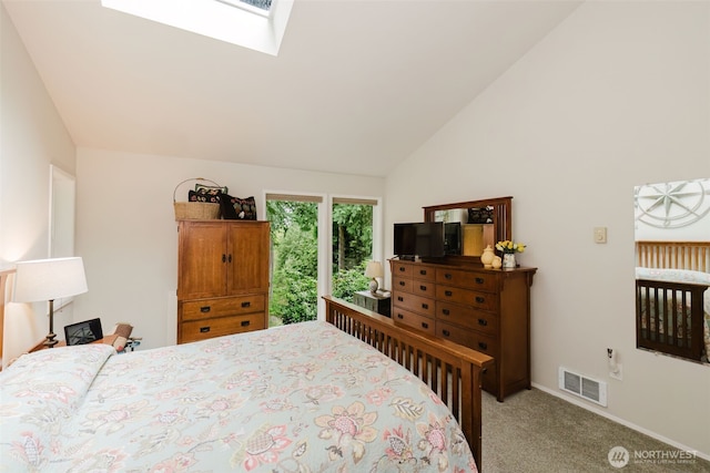 bedroom with carpet floors, baseboards, visible vents, and vaulted ceiling with skylight