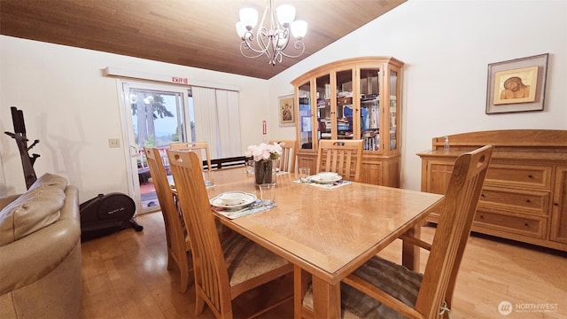 942 S 293rd St, Federal Way, WA 98003 - dining room featuring light wood finished floors, a notable chandelier, and vaulted ceiling
