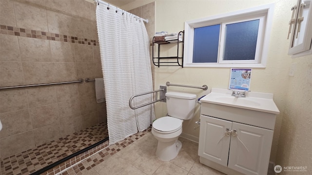 942 S 293rd St, Federal Way, WA 98003 - bathroom featuring vanity, toilet, tile patterned floors, and a stall shower