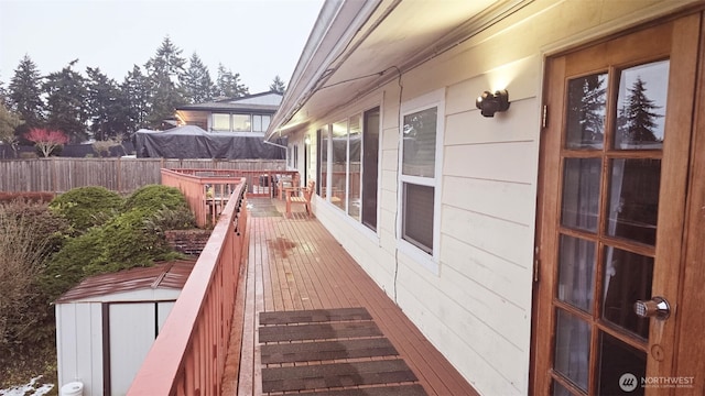 942 S 293rd St, Federal Way, WA 98003 - wooden terrace with a storage unit, fence, and an outbuilding