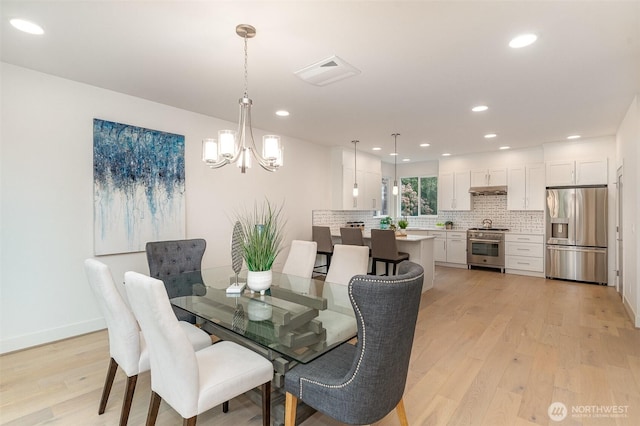 4019B 4th Ave NE, Seattle, WA 98105 - dining room featuring visible vents, light wood-style floors, baseboards, recessed lighting, and a notable chandelier