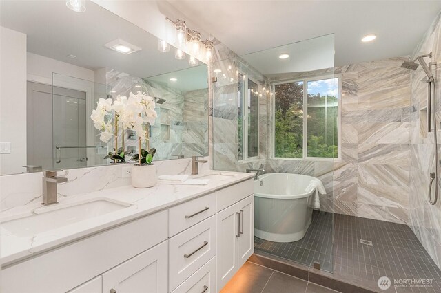 4019B 4th Ave NE, Seattle, WA 98105 - bathroom with a sink, tile patterned floors, a soaking tub, and a stall shower