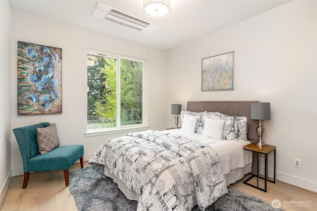 4019B 4th Ave NE, Seattle, WA 98105 - bedroom featuring baseboards, wood finished floors, and visible vents