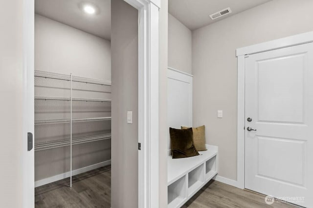 mudroom featuring recessed lighting, baseboards, visible vents, and wood finished floors