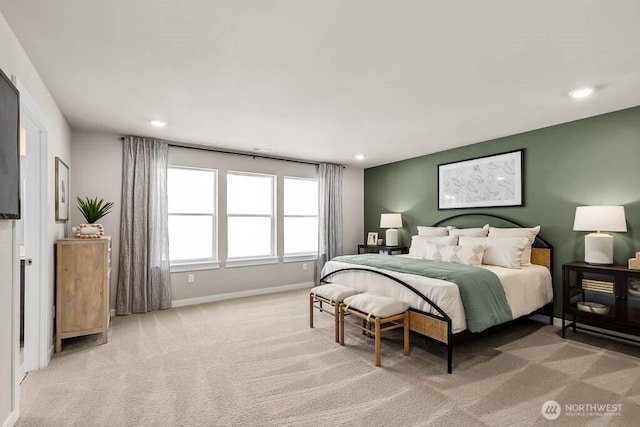bedroom featuring light colored carpet, recessed lighting, and baseboards