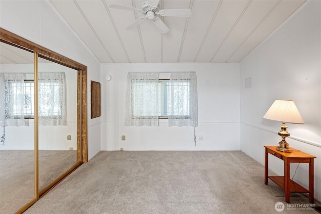 interior space with ceiling fan, vaulted ceiling, and a wealth of natural light