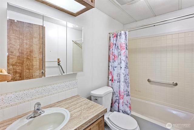full bath featuring vanity, shower / bath combo, toilet, and visible vents