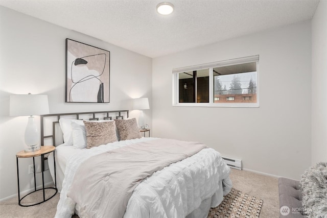 7924 212th St SW Unit 202, Edmonds, WA 98026 - carpeted bedroom with baseboards, a textured ceiling, and baseboard heating