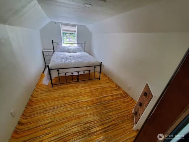 bedroom with lofted ceiling