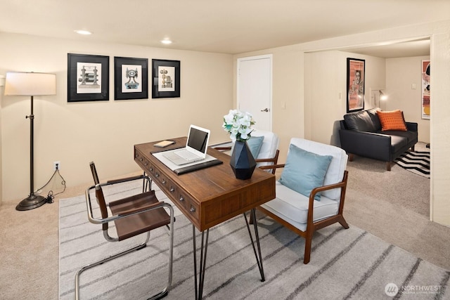 carpeted office with recessed lighting