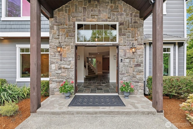 entrance to property with stone siding