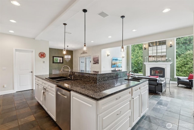 kitchen with stainless steel dishwasher, recessed lighting, and a sink