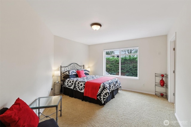 bedroom featuring baseboards and carpet flooring
