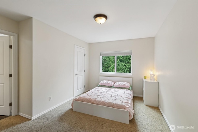 carpeted bedroom with baseboards