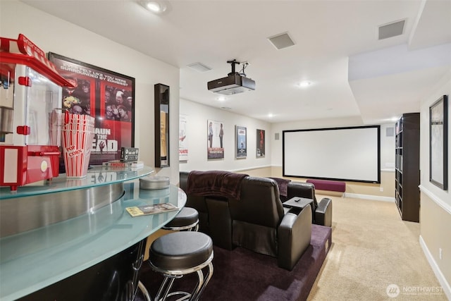 carpeted home theater with recessed lighting and visible vents