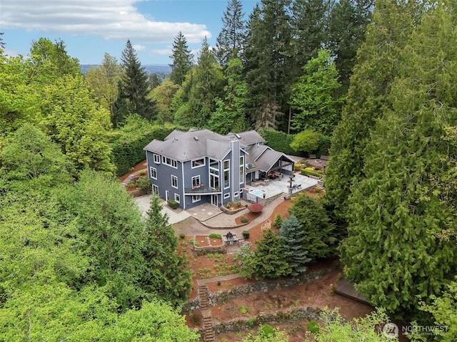 aerial view featuring a view of trees