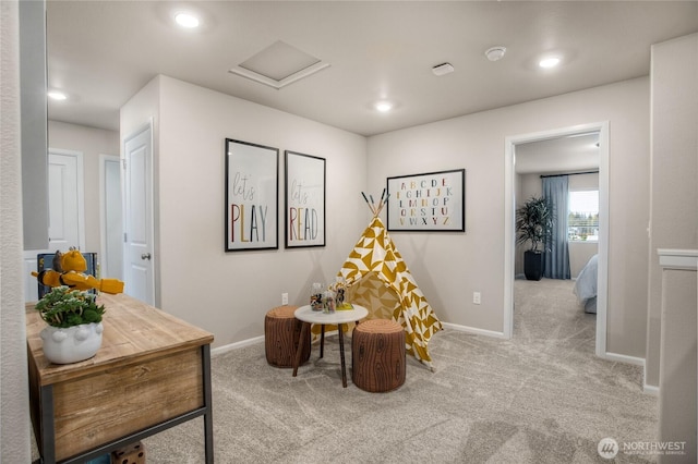 interior space with carpet flooring, recessed lighting, baseboards, and attic access