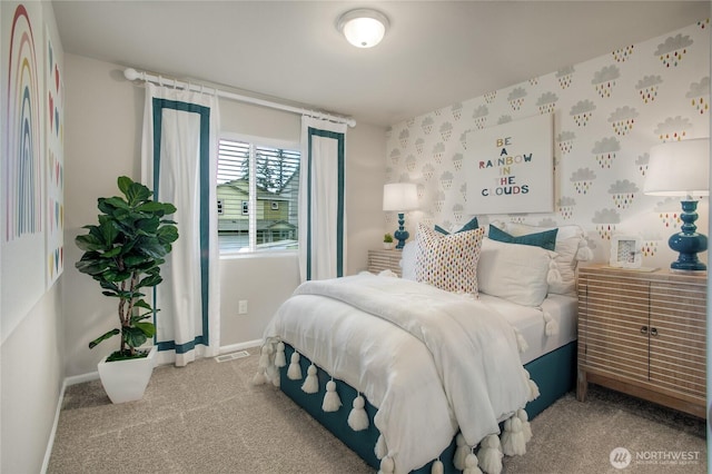 carpeted bedroom featuring baseboards and visible vents