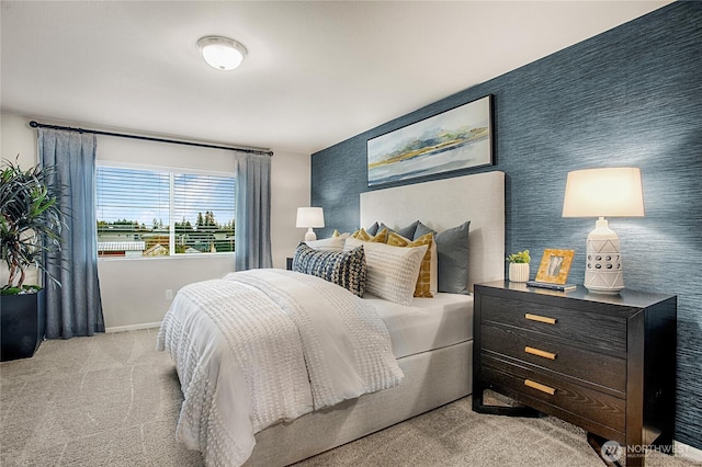 carpeted bedroom featuring baseboards