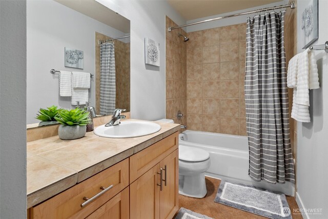 full bath with vanity, shower / bath combo with shower curtain, and toilet