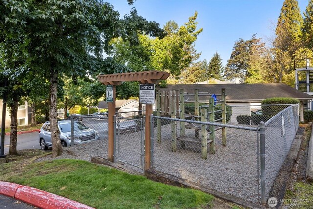 view of play area featuring fence