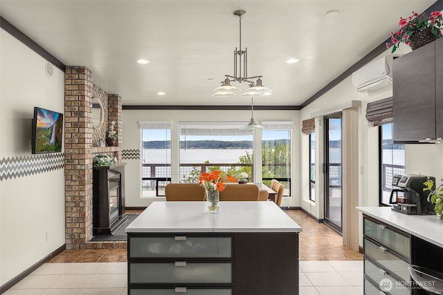 kitchen with light countertops, light tile patterned floors, and a healthy amount of sunlight