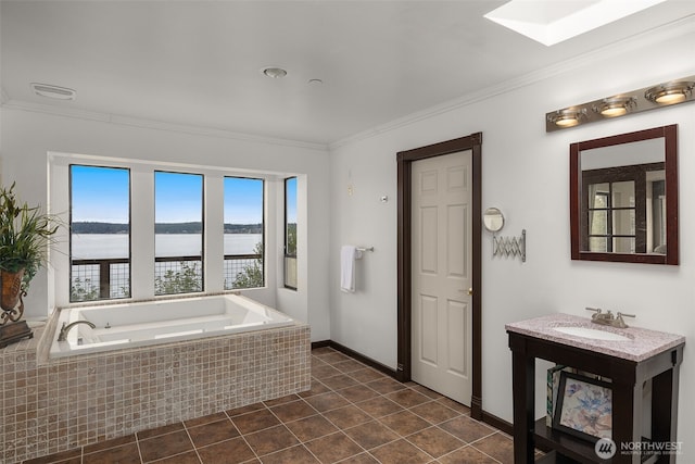 full bathroom with a garden tub, ornamental molding, tile patterned flooring, a water view, and a skylight