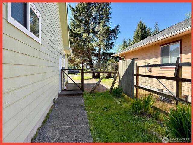 view of property exterior with fence