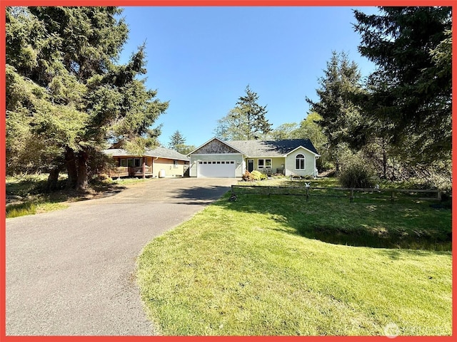 ranch-style house featuring asphalt driveway, a front lawn, and a garage