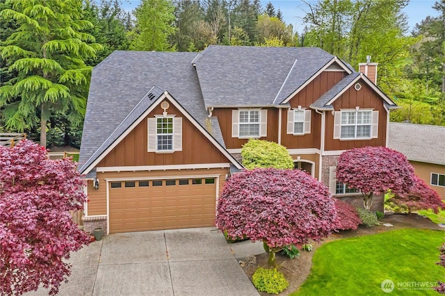 view of front of house featuring roof with shingles, board and batten siding, a chimney, and driveway