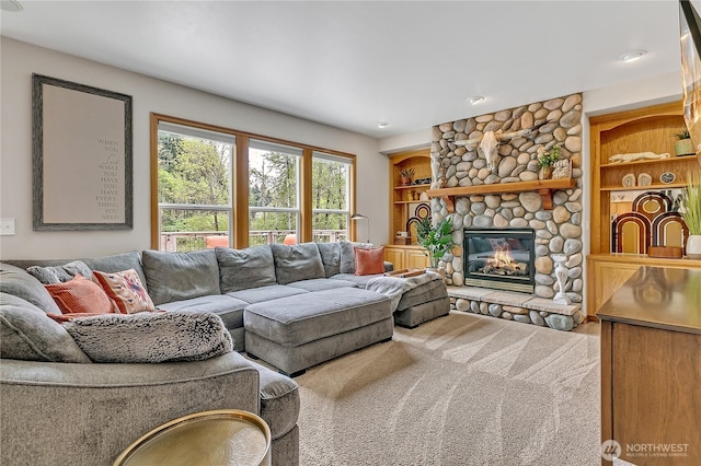 living room with carpet floors and a fireplace