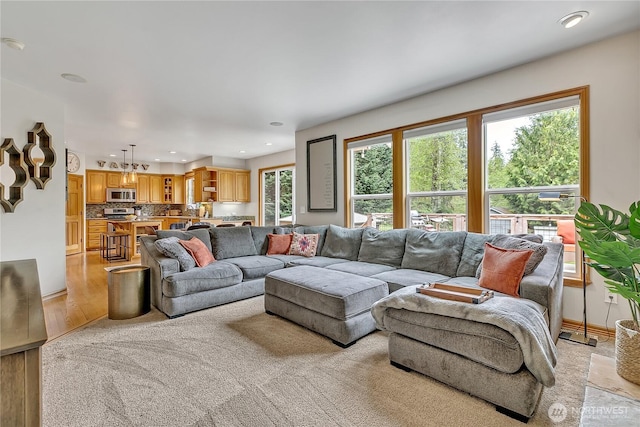living area featuring recessed lighting and light wood-style flooring