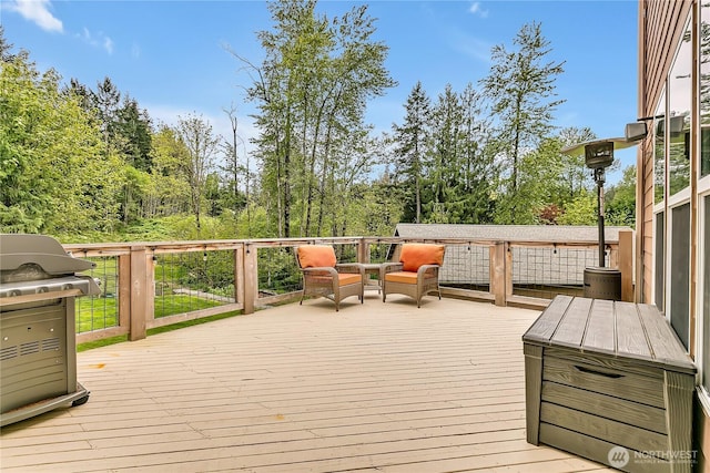 deck featuring a grill