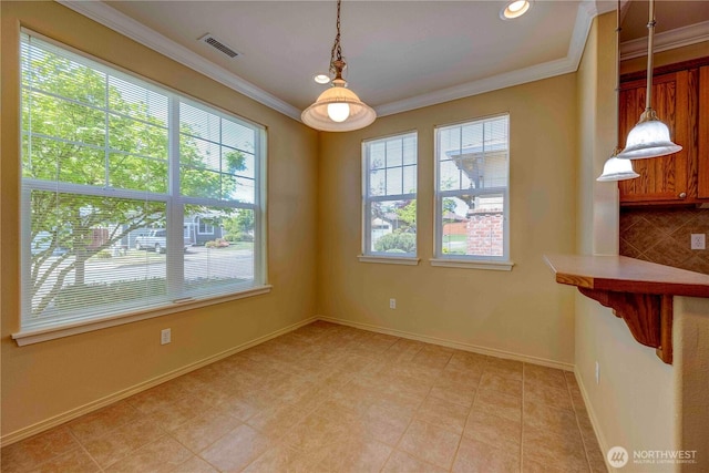 unfurnished dining area featuring crown molding, baseboards, and recessed lighting