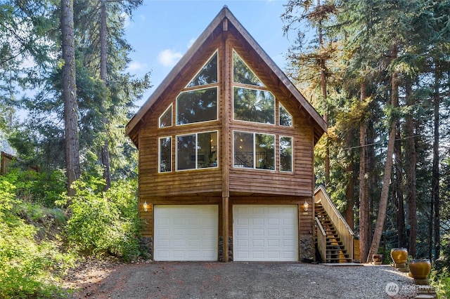 1391 Oakmont Dr, Cle Elum, WA 98922 - view of side of property with a garage, driveway, and stairway