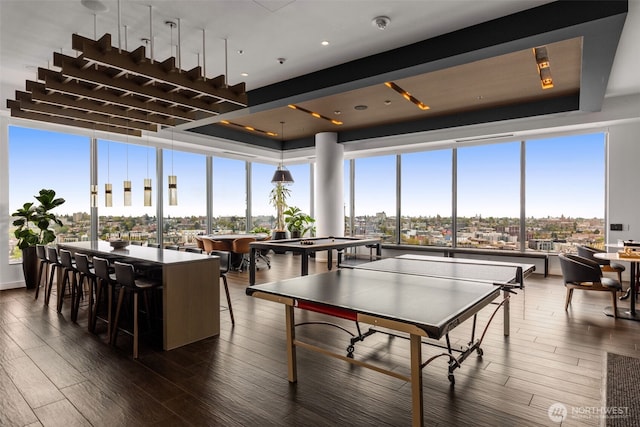 playroom with pool table, dark wood finished floors, and a wall of windows