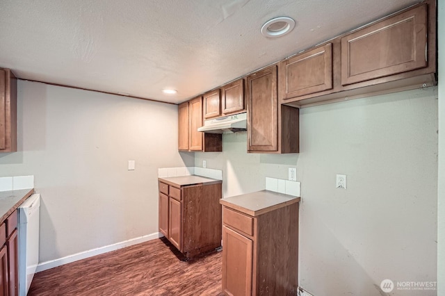 kitchen with white dishwasher, dark wood finished floors, baseboards, under cabinet range hood, and recessed lighting