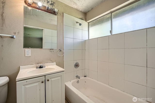 full bath with vanity, shower / bathing tub combination, and toilet