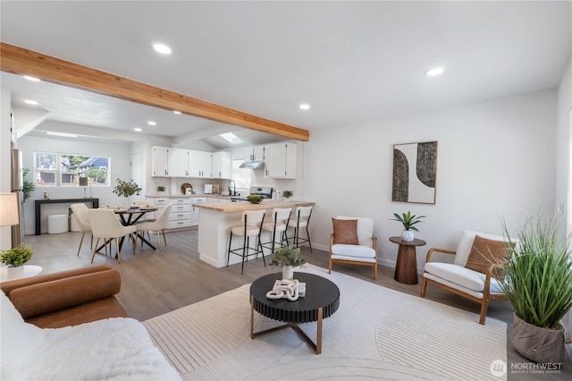 916 S Sheridan Ave, Tacoma, WA 98405 - living area featuring recessed lighting, beam ceiling, and light wood finished floors