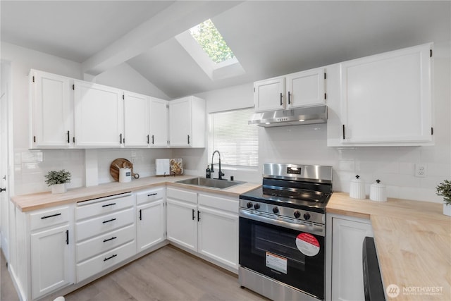 916 S Sheridan Ave, Tacoma, WA 98405 - kitchen featuring stainless steel range oven, under cabinet range hood, a skylight, decorative backsplash, and vaulted ceiling