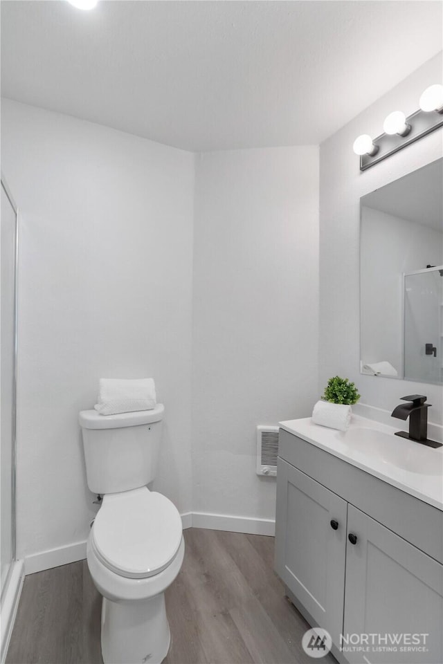 916 S Sheridan Ave, Tacoma, WA 98405 - full bathroom with wood finished floors, vanity, and a stall shower