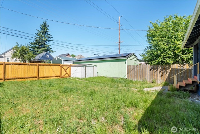 916 S Sheridan Ave, Tacoma, WA 98405 - fenced backyard featuring a storage unit