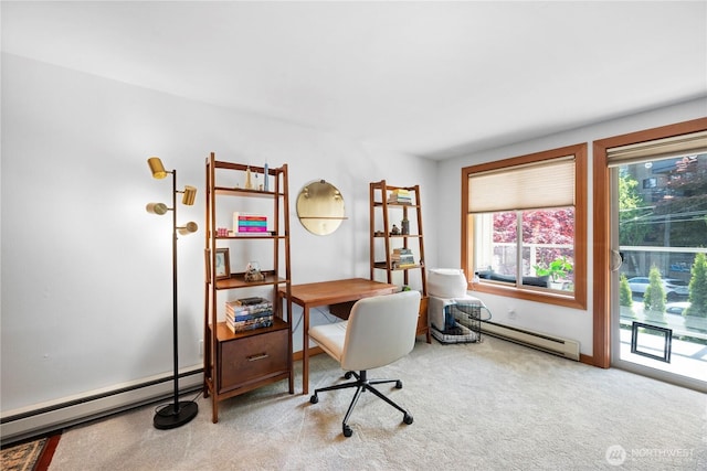 carpeted office featuring a baseboard heating unit and baseboard heating