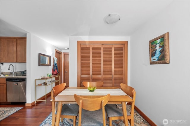 dining room featuring baseboards and dark wood-style flooring