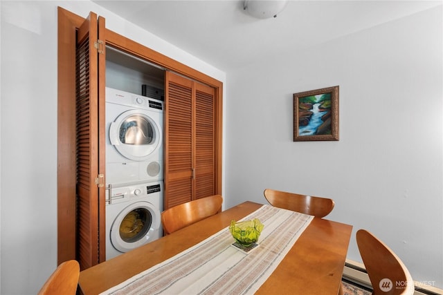 dining room with stacked washer / dryer