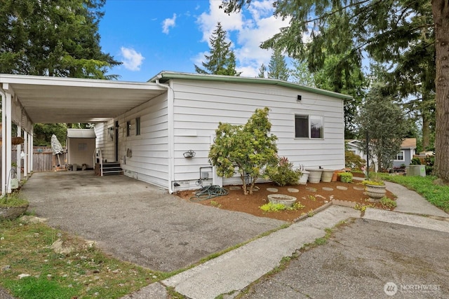 19003 129th Ave NE, Bothell, WA 98011 - view of front of house featuring asphalt driveway, an attached carport, and entry steps