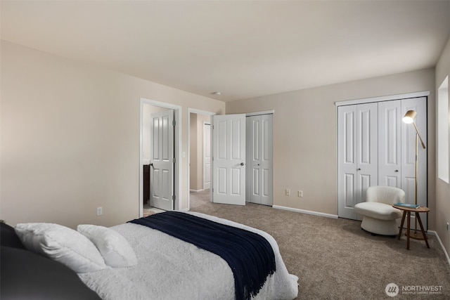bedroom featuring carpet floors, baseboards, and multiple closets