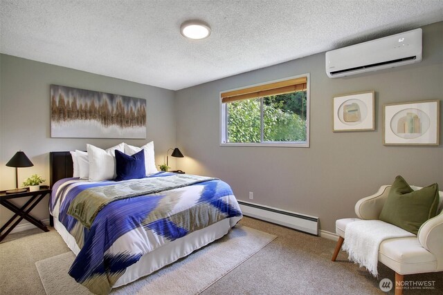 bedroom with carpet flooring, a baseboard radiator, a textured ceiling, and a wall unit AC