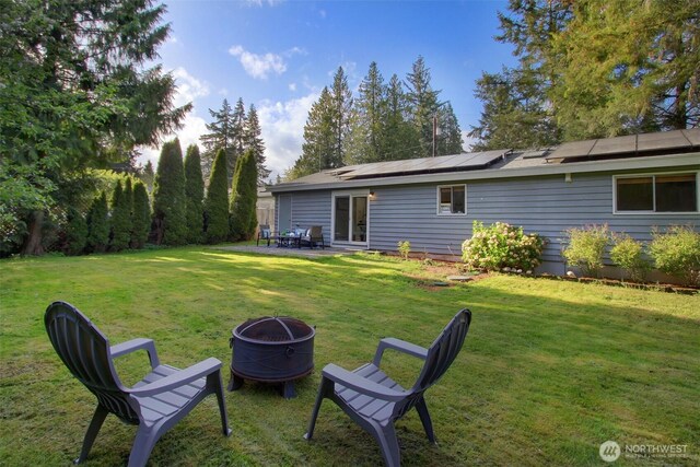 view of yard with a patio and a fire pit