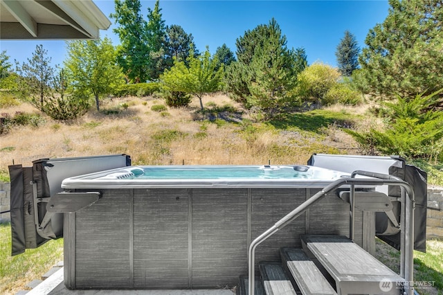 exterior space with a hot tub